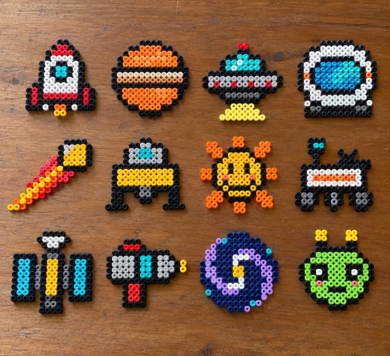 Retro Space — Finished bead projects on a wooden tabletop