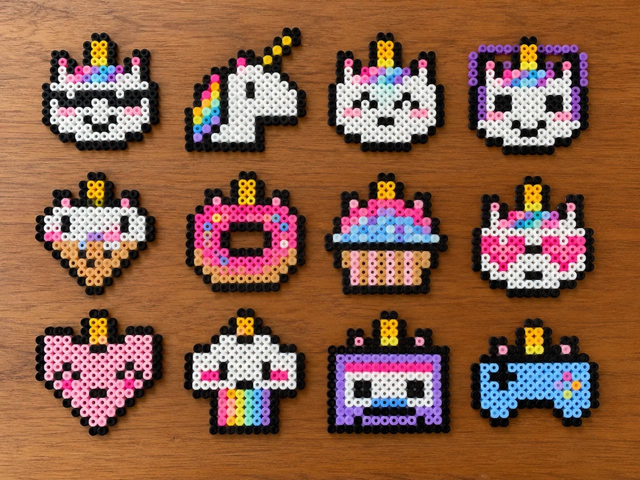12 Unicorn Patterns — Finished bead projects on a wooden tabletop
